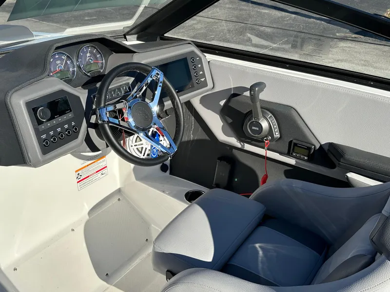 Slide: The Image of 2024 Cobalt CS22 boat interior with modern dashboard and steering wheel. - 14