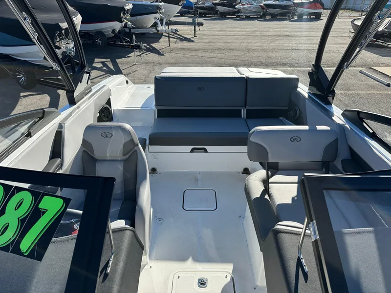 Slide: The Image of 2024 Cobalt CS22 boat interior with gray seating and modern design. - 16