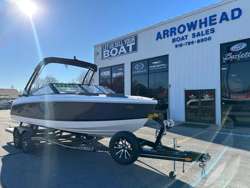 Slide: The Image of 2024 Cobalt CS22 boat on trailer at Arrowhead Boat Sales dealership. - 2