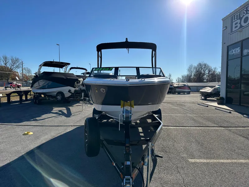 Slide: The Image of 2024 Cobalt CS22 boat on trailer in sunny outdoor showroom. - 3