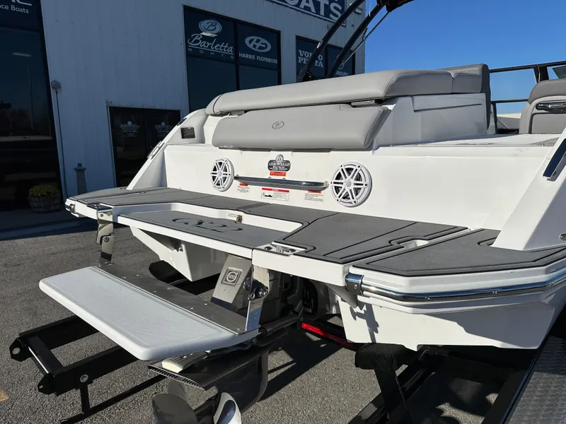 Slide: The Image of 2024 Cobalt CS22 boat rear view with swim platform and speakers. - 9