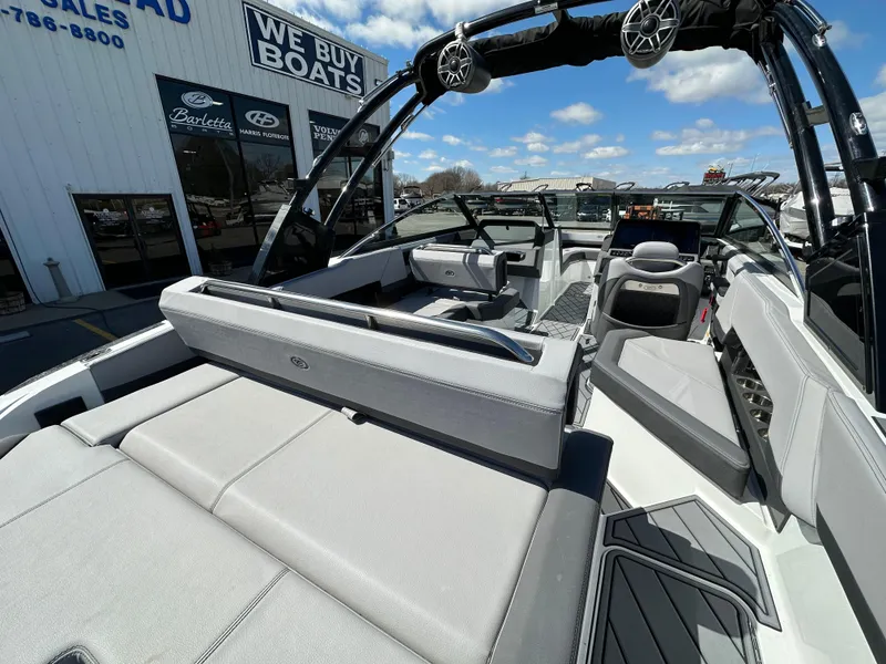 Slide: The Image of 2023 Cobalt R4 boat interior at dealership, featuring sleek seating and modern design. - 12