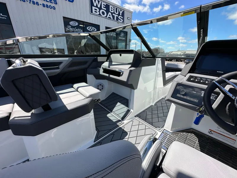 Slide: The Image of Interior of 2023 Cobalt R4 boat, featuring modern dashboard and seating. - 17