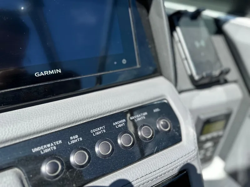 Slide: The Image of Cobalt R4 2023 dashboard with Garmin display and light controls. - 23