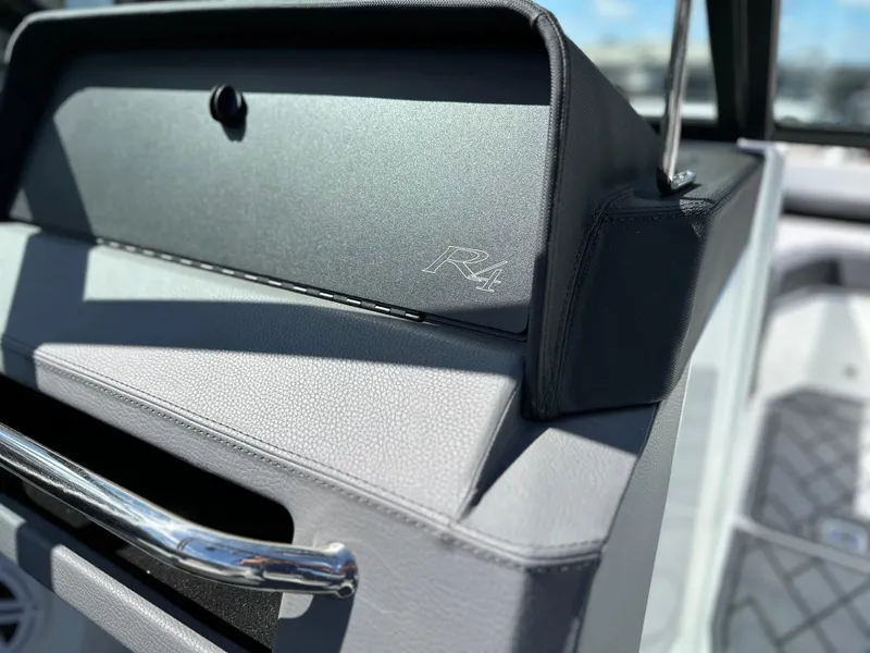 Slide: The Image of 2023 Cobalt R4 boat interior with sleek design and chrome accents. - 26