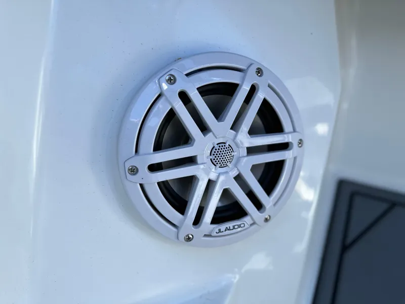 Slide: The Image of White JL Audio speaker on 2023 Cobalt R4 boat. - 27