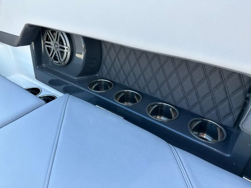 Slide: The Image of 2023 Cobalt R4 interior with speaker and cup holders, featuring quilted panel design. - 29