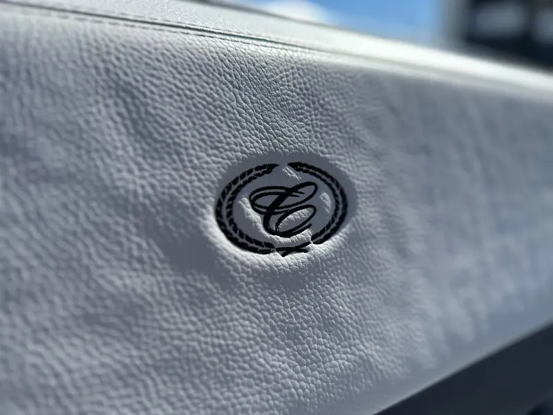 Slide: The Image of 2023 Cobalt R4 interior detail with embossed logo on white leather. - 30