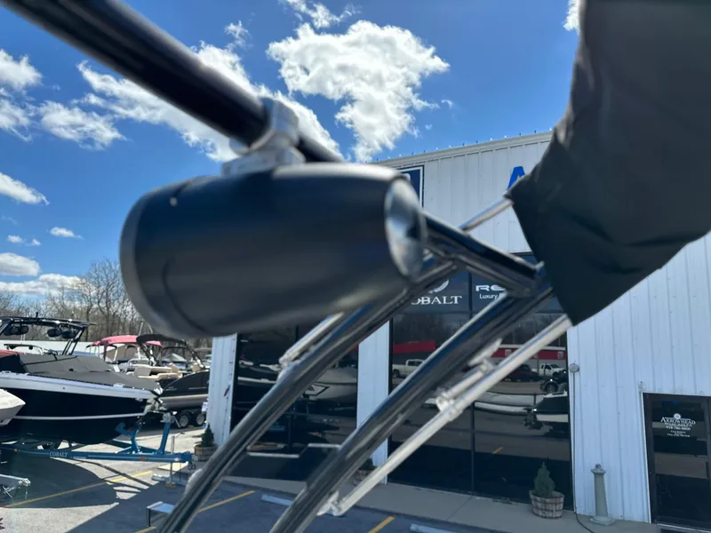 Slide: The Image of Close-up of 2023 Cobalt R4 boat detail with dealership in background. - 36