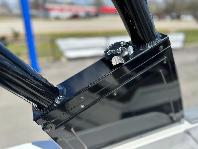 Slide: The Image of Close-up of 2023 Cobalt R4 boat hardware with sleek black finish. - 37