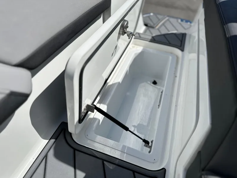 Slide: The Image of Open storage compartment on 2023 Cobalt R4 boat, featuring sleek design and durable materials. - 38