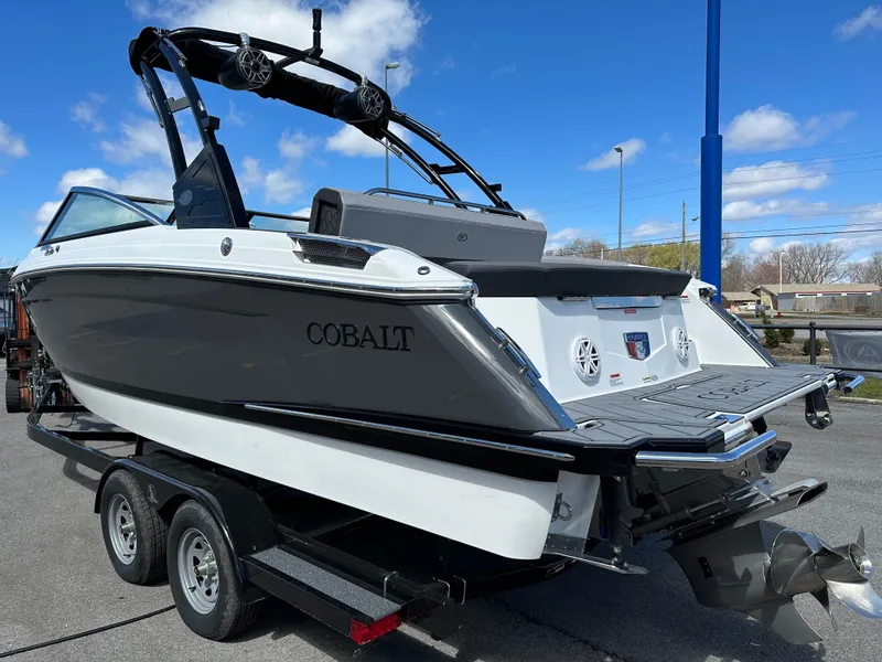 Slide: The Image of 2023 Cobalt R4 boat on trailer under blue sky. - 4