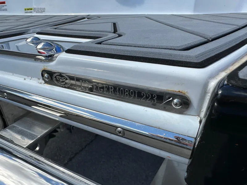 Slide: The Image of 2023 Cobalt R4 boat detail with identification plate and chrome accents. - 41