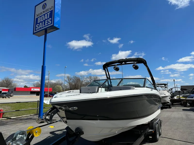 Slide: The Image of 2023 Cobalt R4 boat at Arrowhead Boat Sales under a clear blue sky. - 8