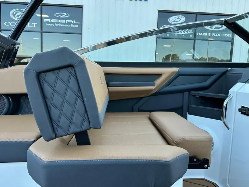 Slide: The Image of 2024 Cobalt R6 boat interior with tan and black seating, luxury design details. - 14