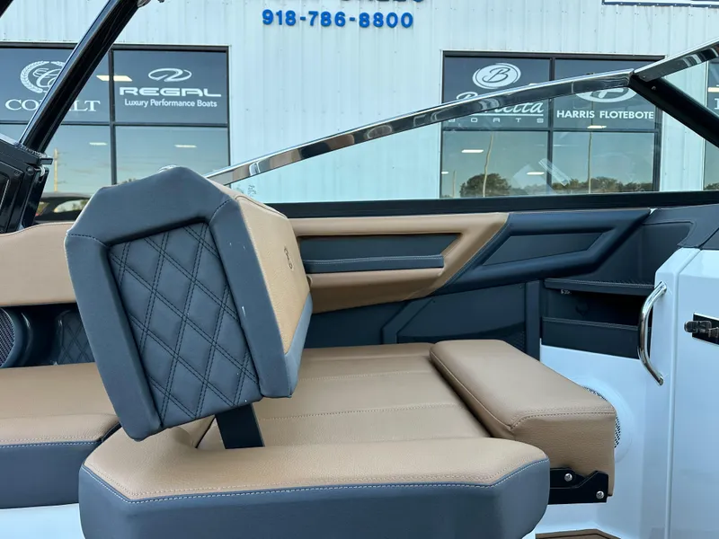 Slide: The Image of 2024 Cobalt R6 boat interior with tan and black seating, luxury design details. - 15