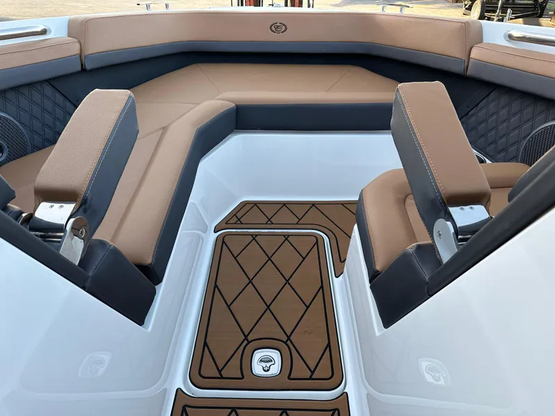 Slide: The Image of 2024 Cobalt R6 boat interior with tan and black seating, diamond-patterned flooring. - 22