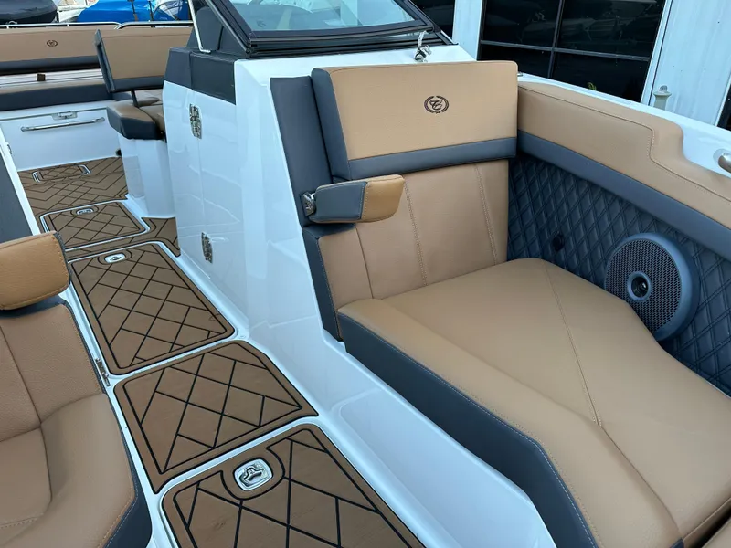Slide: The Image of Luxurious interior of 2024 Cobalt R6 boat with tan and gray seating. - 24