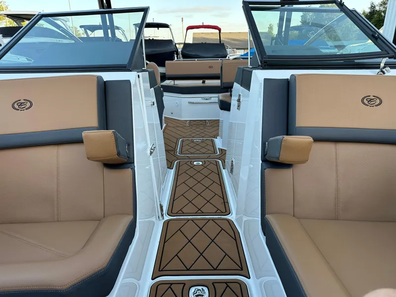Slide: The Image of 2024 Cobalt R6 boat interior with tan and black seating, elegant design. - 25