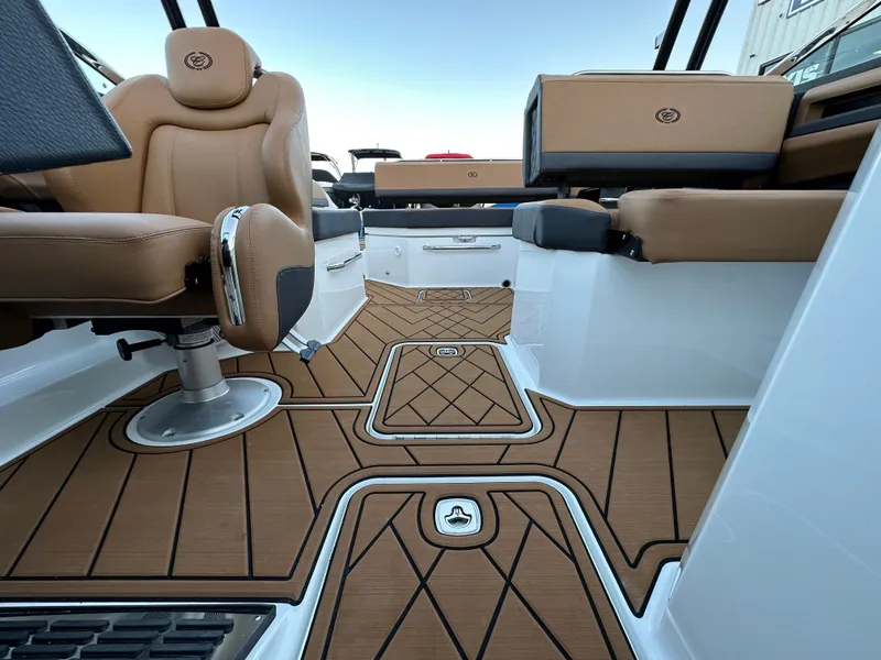 Slide: The Image of 2024 Cobalt R6 boat interior with tan seating and stylish flooring. - 26