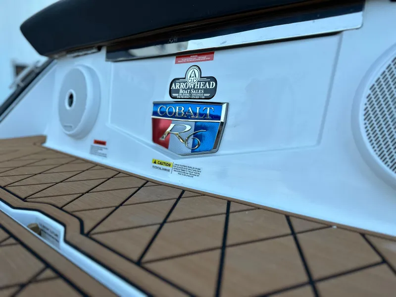 Slide: The Image of 2024 Cobalt R6 boat with Arrowhead Boat Sales logo on deck. - 29
