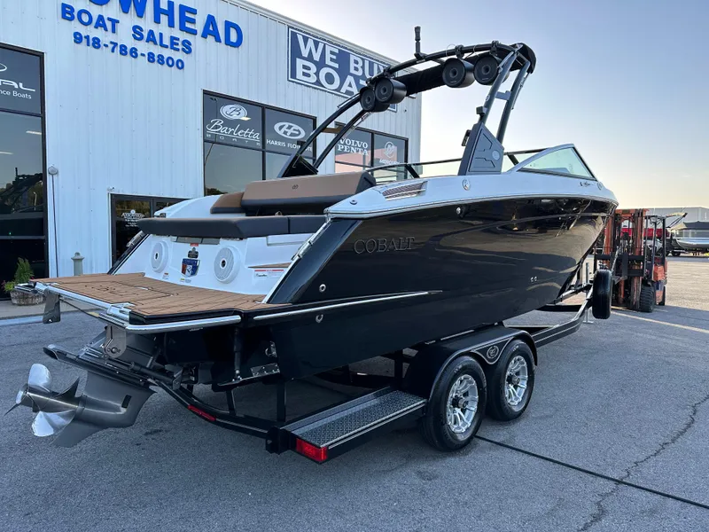 Slide: The Image of 2024 Cobalt R6 boat on trailer at dealership, showcasing sleek design and modern features. - 3