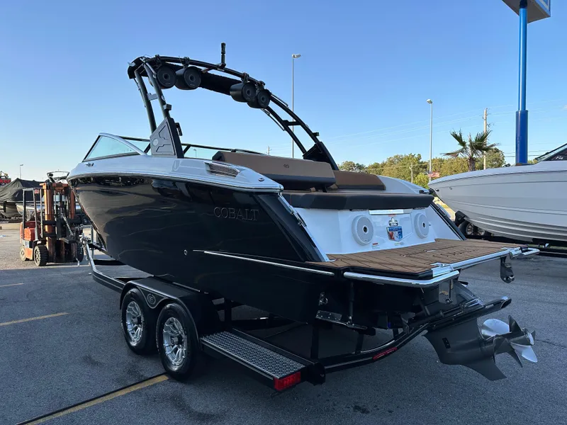 Slide: The Image of 2024 Cobalt R6 boat on trailer, sleek design, outdoor display. - 5