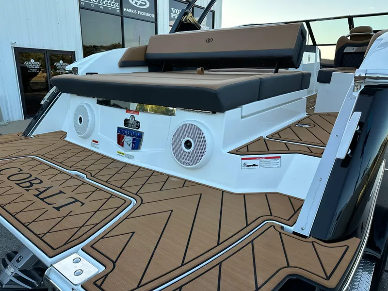 Slide: The Image of 2024 Cobalt R6 boat with stylish deck and seating, featuring premium audio speakers. - 9