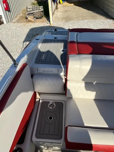 Slide: The Image of 2018 Cownline 225ss boat interior with red and white seating. - 10
