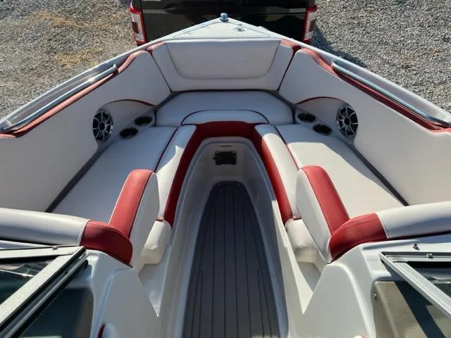 Slide: The Image of 2018 Cownline 225ss boat interior with red and white seating. - 3
