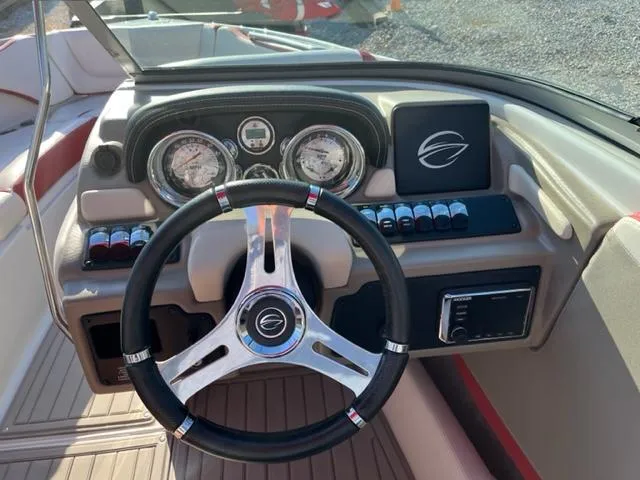 Slide: The Image of 2018 Cownline 225ss boat dashboard with steering wheel and gauges. - 5