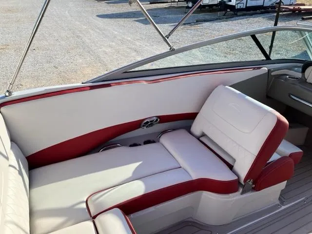 Slide: The Image of 2018 Cownline 225ss boat interior with red and white seating, sleek design. - 8