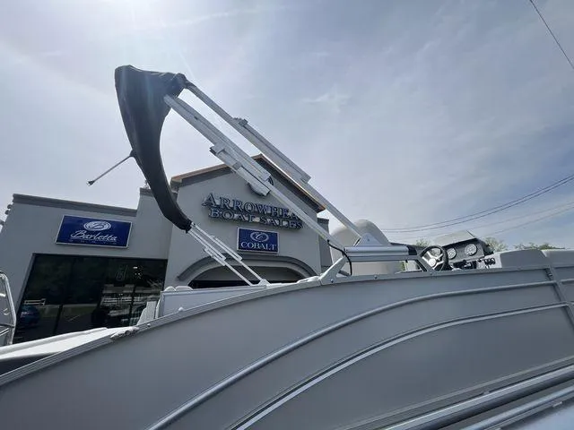 Slide: The Image of 2024 Harris 230CX boat at Arrowhead Boat Sales dealership. - 16