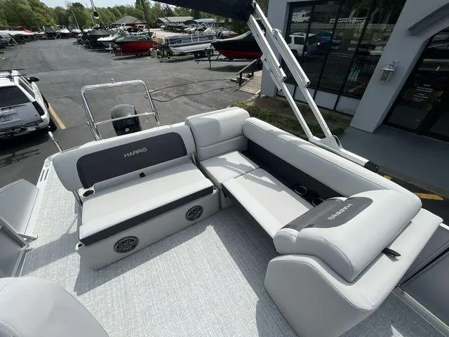 Slide: The Image of 2024 Harris 230CX boat interior with gray seating and modern design. - 27