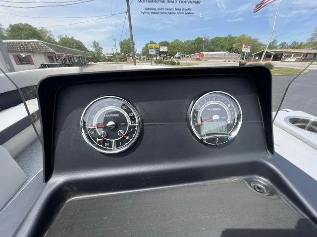 Slide: The Image of Dashboard of 2024 Harris 230CX boat with speedometer and fuel gauge. - 7