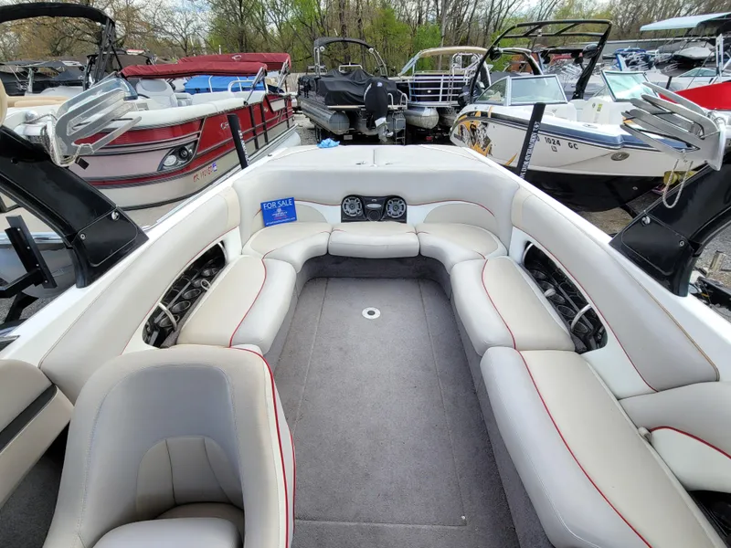Slide: The Image of 2007 Malibu 247 Wakesetter interior with spacious seating, for sale sign visible. - 11