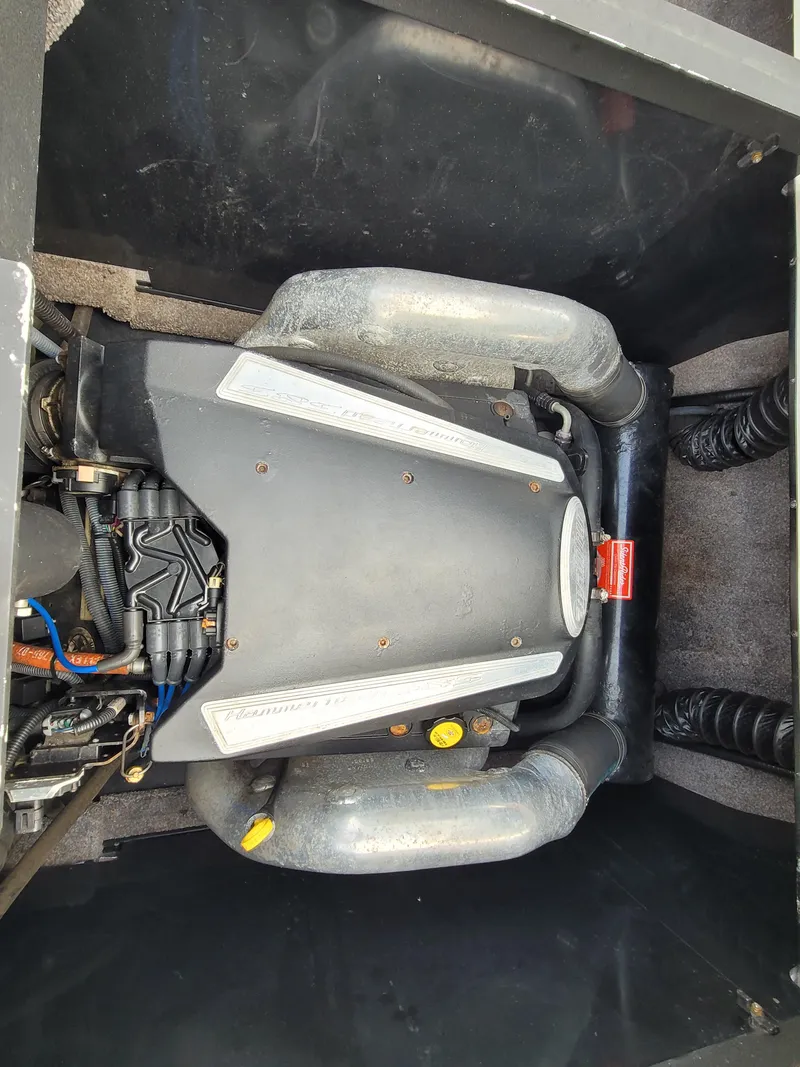 Slide: The Image of 2007 Malibu 247 Wakesetter engine compartment, showcasing powerful marine engine components. - 13
