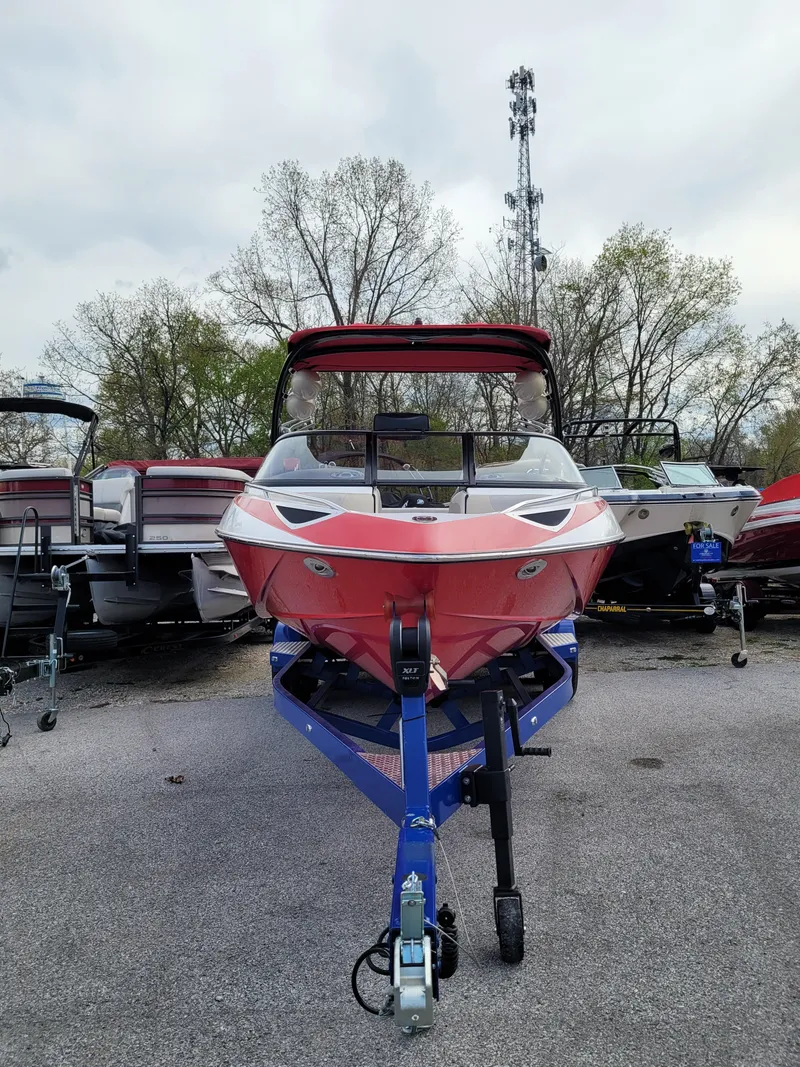Slide: The Image of 2007 Malibu 247 Wakesetter boat on trailer, parked outdoors. - 14