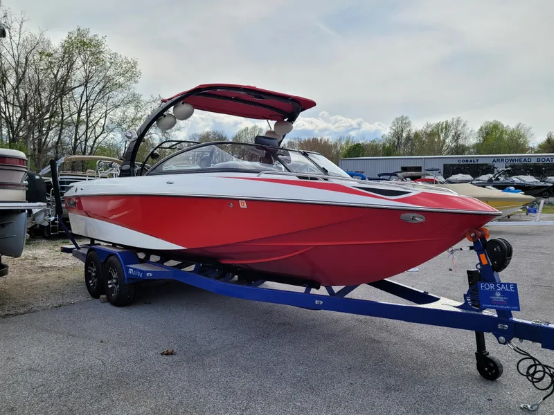 Slide: The Image of 2007 Malibu 247 Wakesetter boat in red and white, on a trailer, for sale. - 16