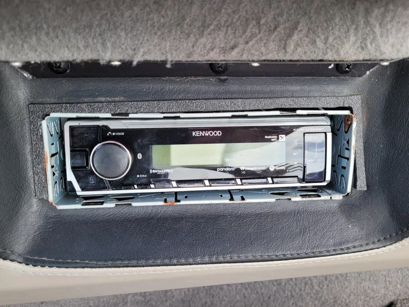 Slide: The Image of Kenwood stereo system in 2007 Malibu 247 Wakesetter boat dashboard. - 17