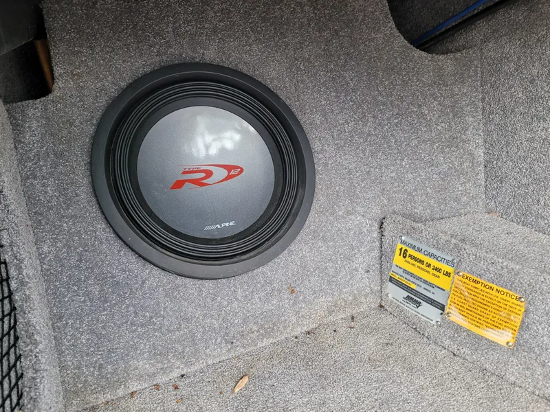 Slide: The Image of Alpine subwoofer in 2007 Malibu 247 Wakesetter boat interior. - 18