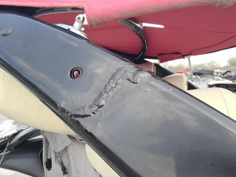 Slide: The Image of Close-up of damaged black frame on 2007 Malibu 247 Wakesetter boat. - 19