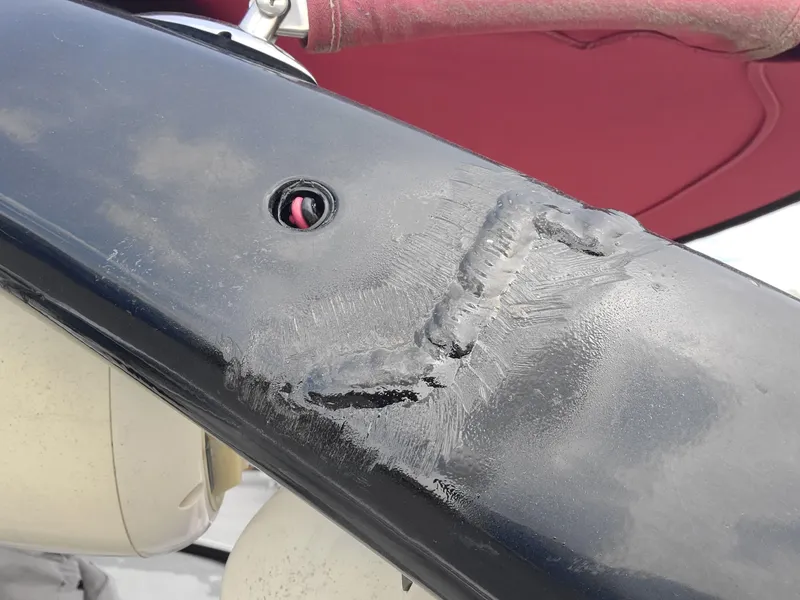 Slide: The Image of Damaged surface on 2007 Malibu 247 Wakesetter boat with visible repair marks. - 20