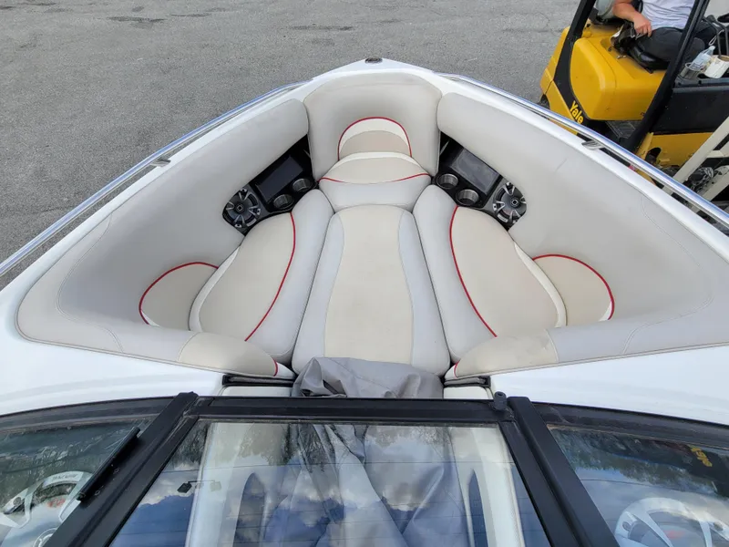 Slide: The Image of 2007 Malibu 247 Wakesetter boat interior with white and red seating. - 6