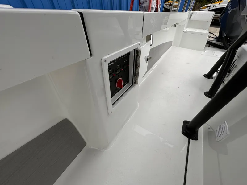 Slide: The Image of 2025 Parker 23SE Center Console boat interior with control panel and seating. - 19