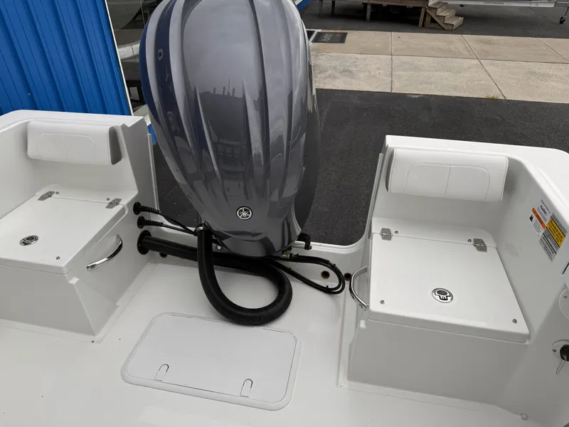 Slide: The Image of 2025 Parker 23SE Center Console boat with powerful outboard motor. - 23