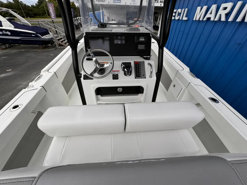 Slide: The Image of 2025 Parker 23SE Center Console boat interior with steering wheel and controls. - 26