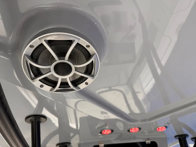 Slide: The Image of Close-up of a speaker and lights on a 2025 Parker 23SE Center Console boat. - 31
