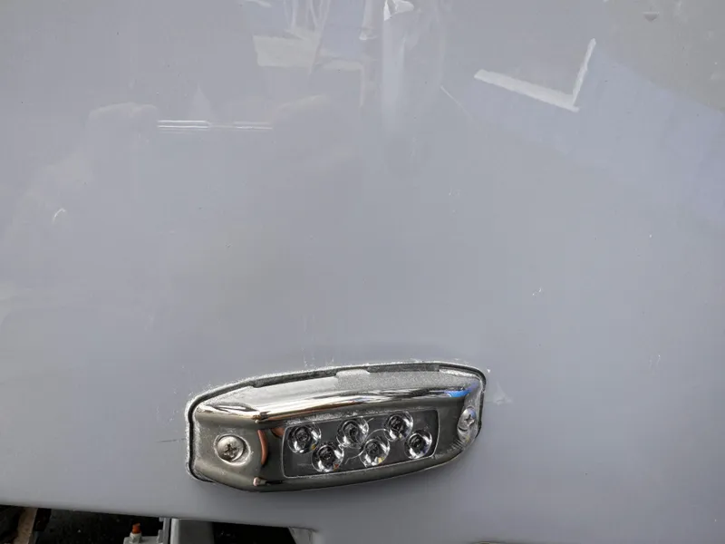 Slide: The Image of Close-up of a 2025 Parker 23SE Center Console boat light fixture. - 33