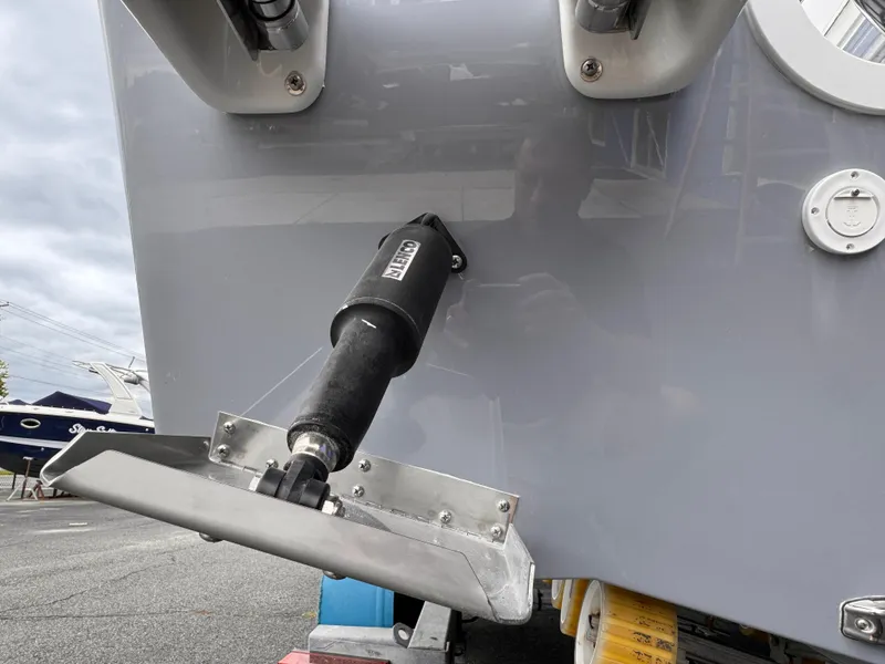 Slide: The Image of 2025 Parker 23SE Center Console boat with trim tab detail. - 4